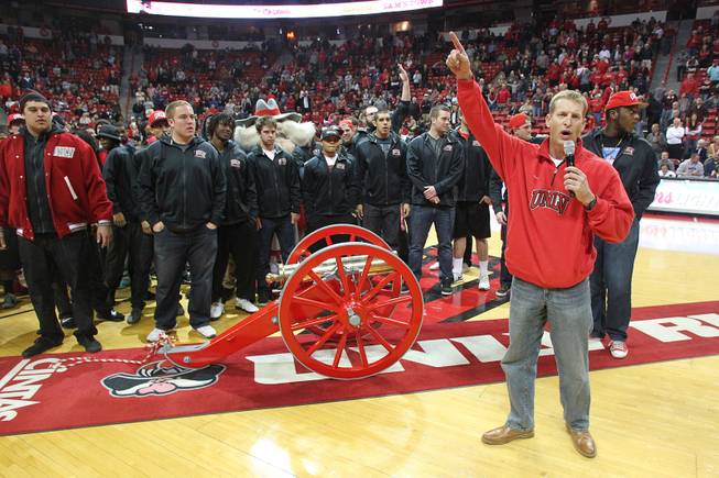 The UNLV football team and coach Bobby Hauck make an appearance at half time of UNLV's basketball game against Sacred Heart Friday, Dec. 20, 2013 at the Thomas & Mack Center. UNLV won the game 82-50.